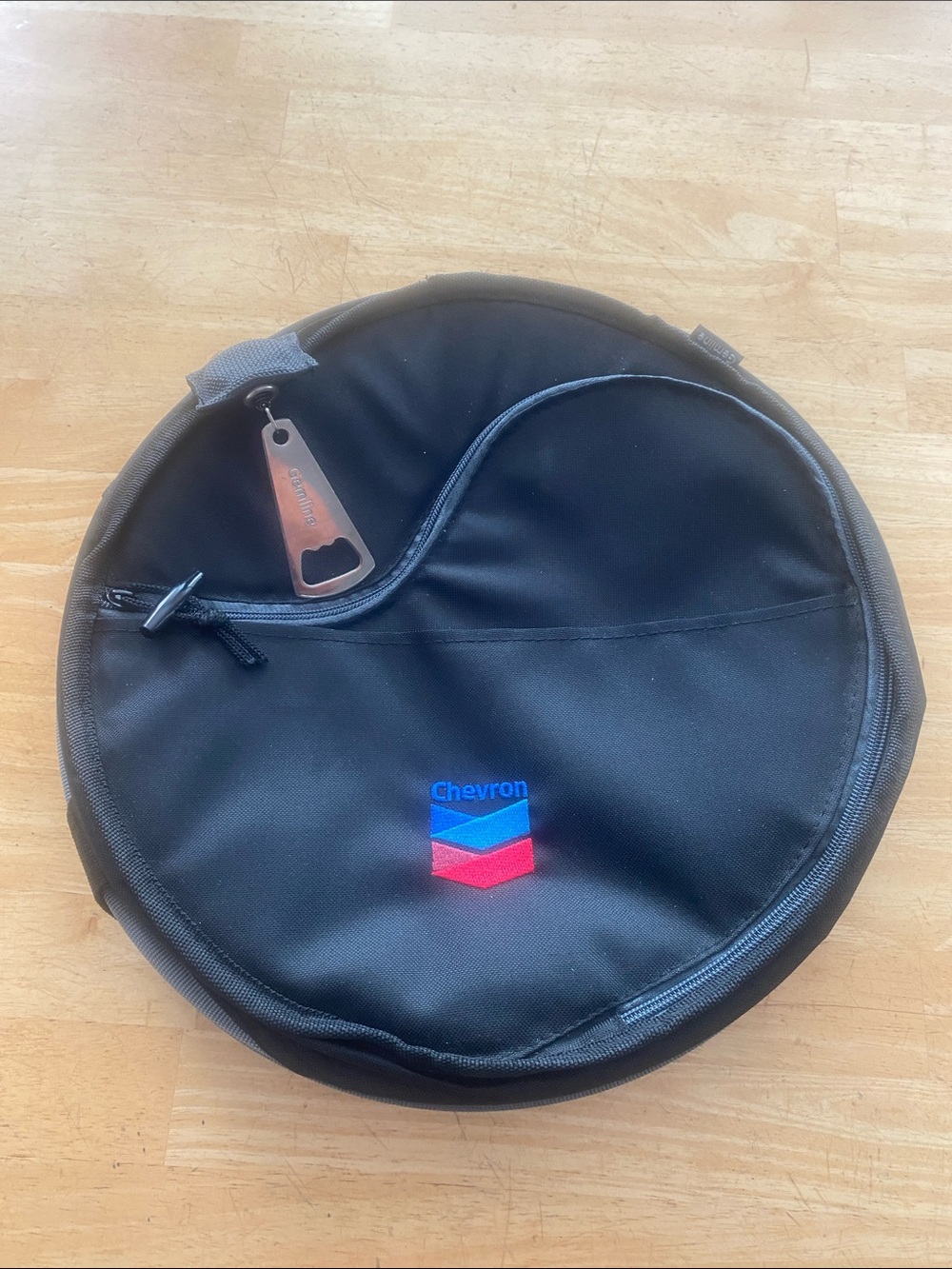 Round insulated Chevron branded cooler bag 13 across 9 in high Folds to store